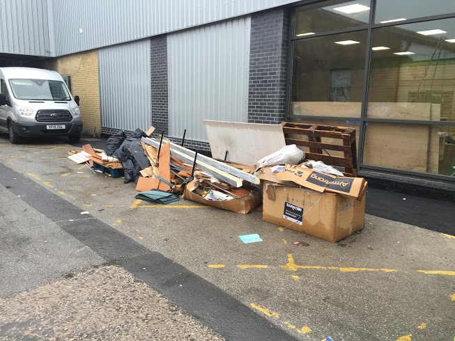 Picture showing commercial waste outside of the building ready to be cleared.