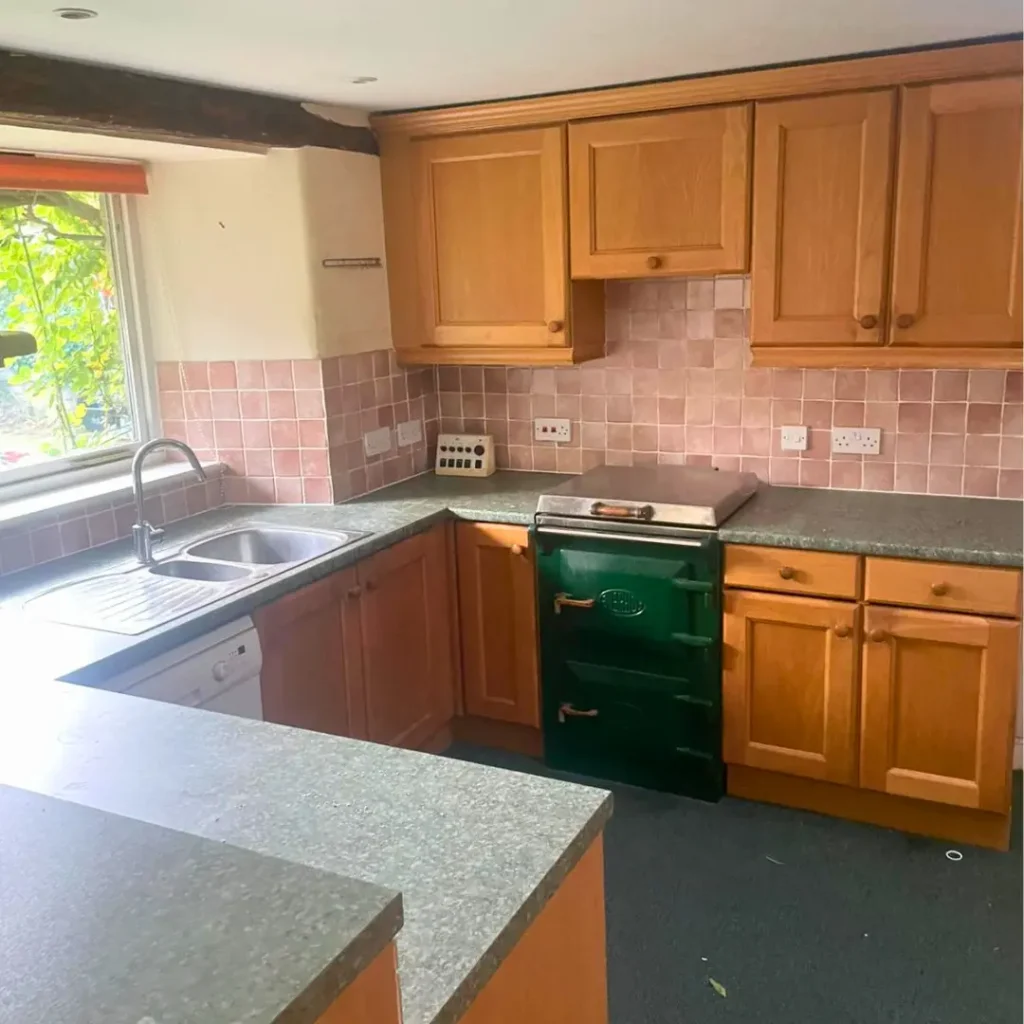 Kitchen after a professional house clearance with clean worktops and all unwanted household items removed.