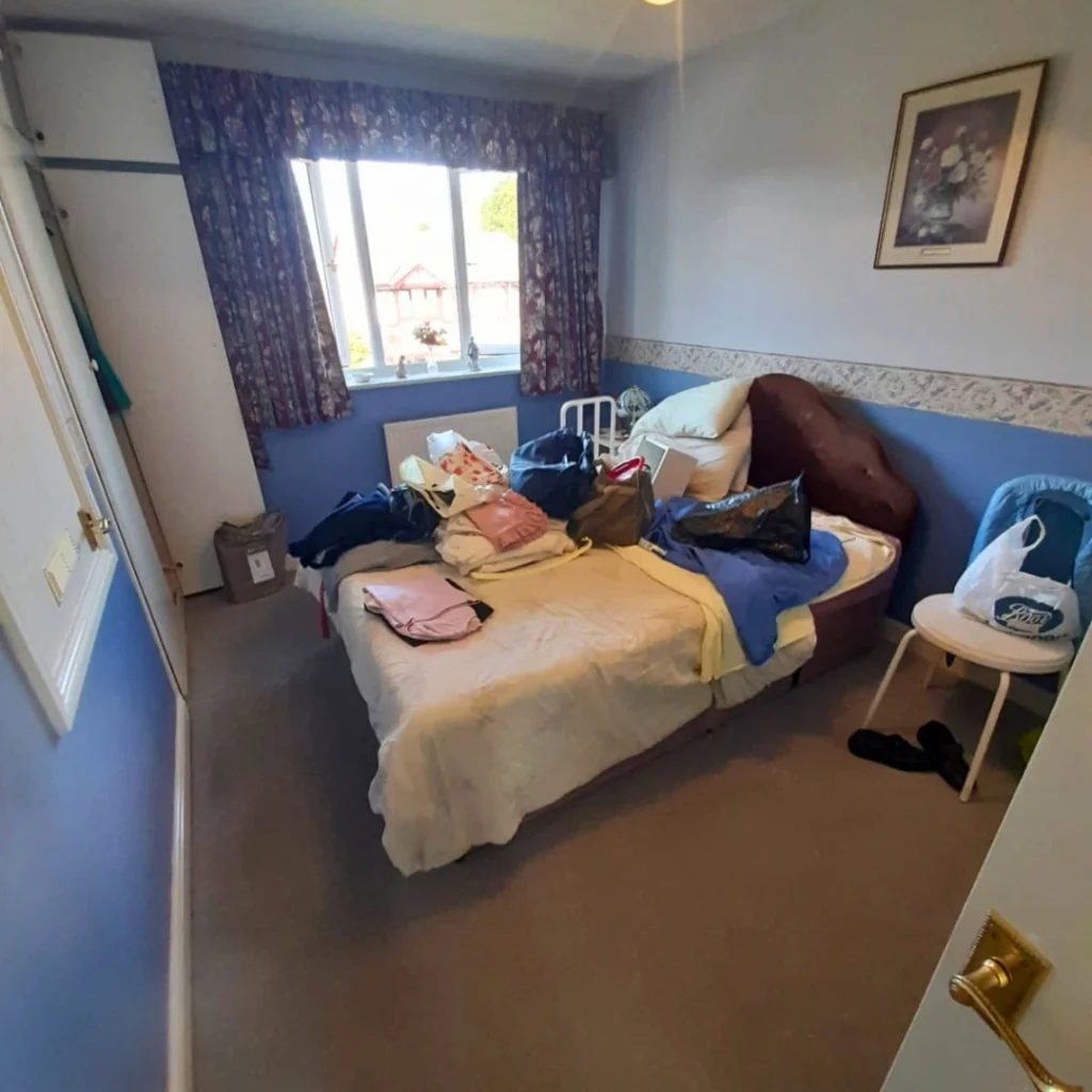 A cluttered bedroom before a clearance service by The Rubbish Removers