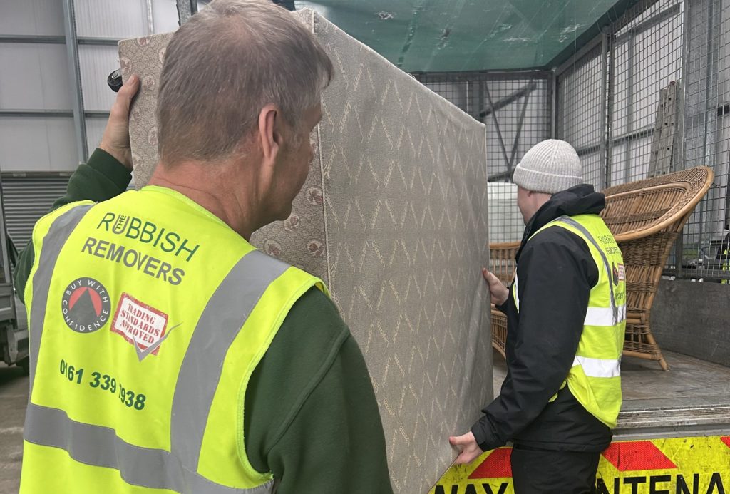 Our Sheffield Mattress removal team loading a bed base onto our vehicle.