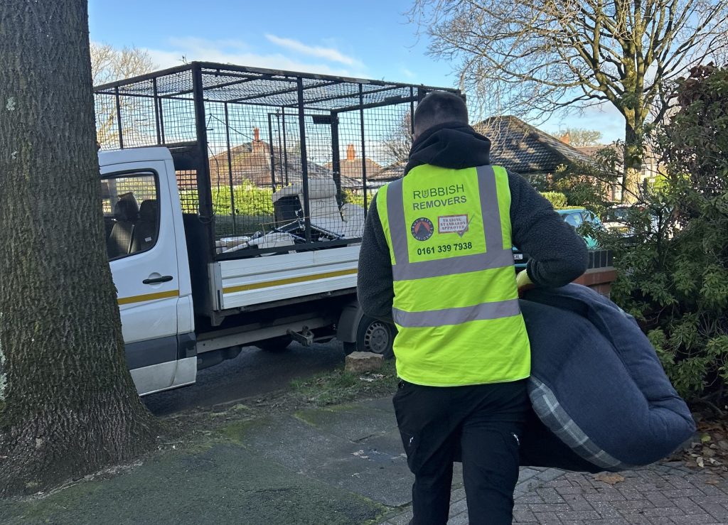 We cleared a decade of accumulated household junk and old furniture, sweeping the floor clean so the owner could reclaim their storage space.
