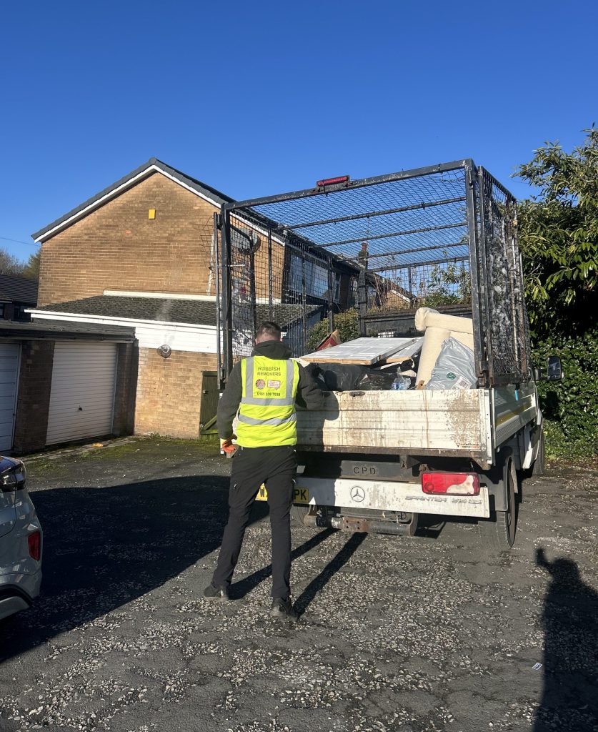Waste being loaded from a house clearance ready for the property to be renovated.