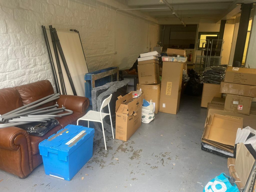 Mixed bulky waste, wooden furniture, and cardboard cleared from a garage in Eccleshall.
