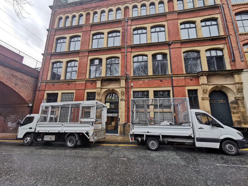 Picture showing 2 of our vehicles ready to clear an office building.