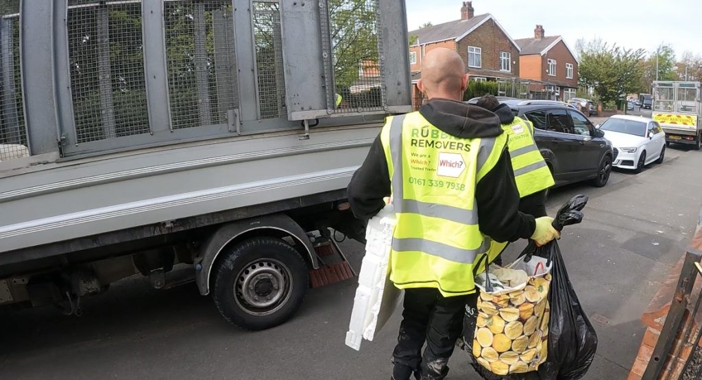 The Rubbish Removers crew loading waste onto the van during a house clearance service