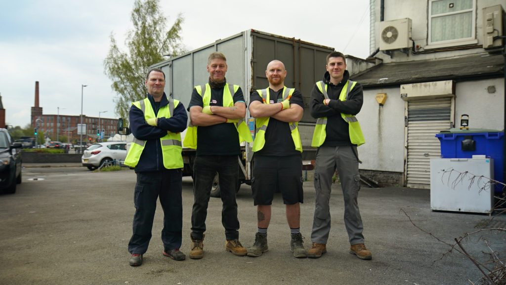 A few of our team members pictured at the end of a clearance wearing full uniform.