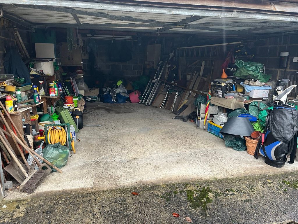 Image showing a garage full of contents before we cleared it.