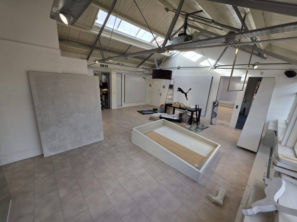One of the most demanding parts of this Manchester office clearance involved removing heavy mobile shop fittings and large wheeled display walls from the 5th and 6th floors.
