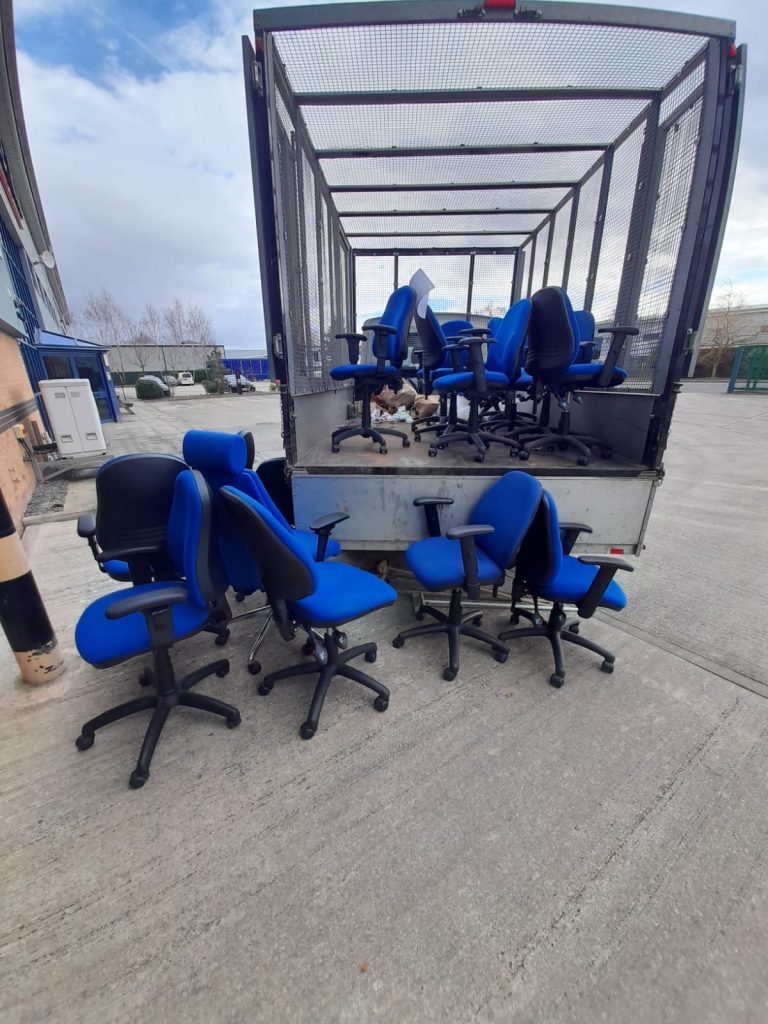 Image showing office chairs on our vehicle ready for disposal.