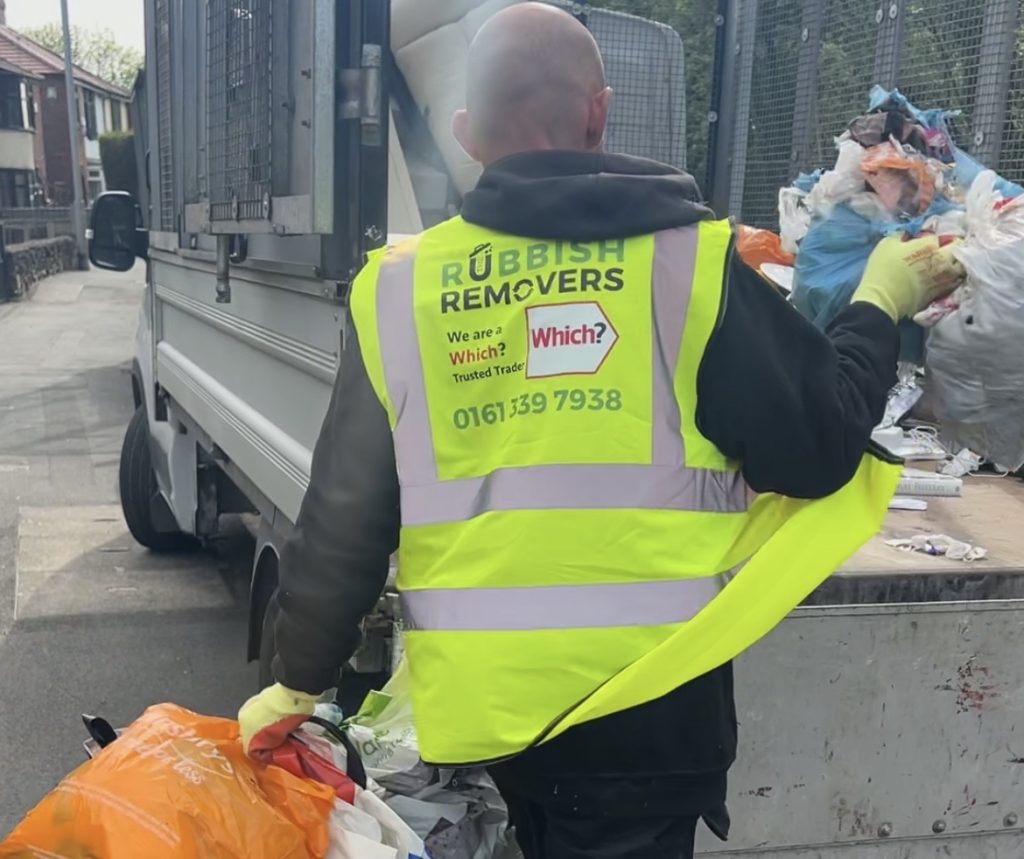 Image of staff member collecting bin waste from a customers house in Bradford.