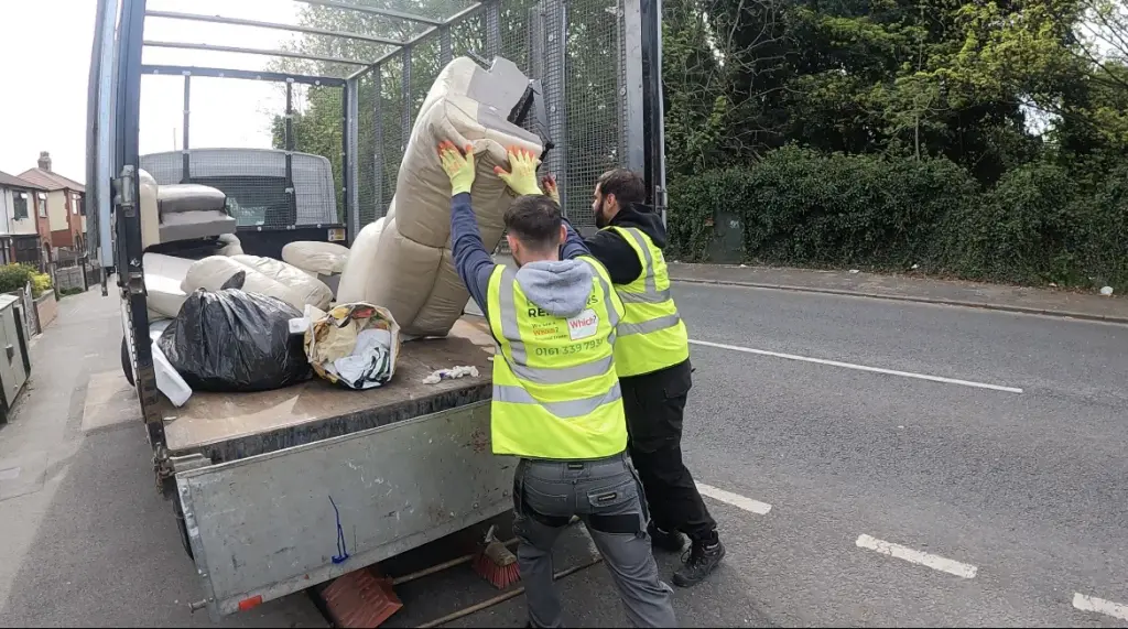 The sofa being loaded onto the van after the removal from the property