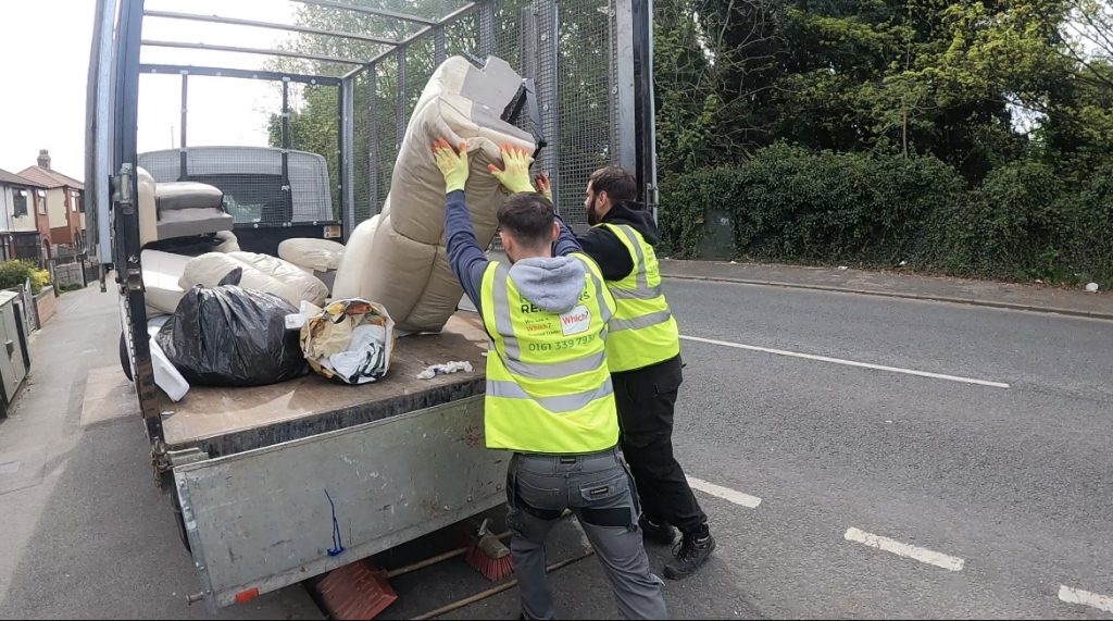 Living room furniture being loaded onto the van