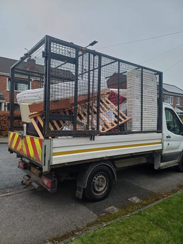 Image showing our vehicle full of mattresses and bed frames from a clearance of a property.