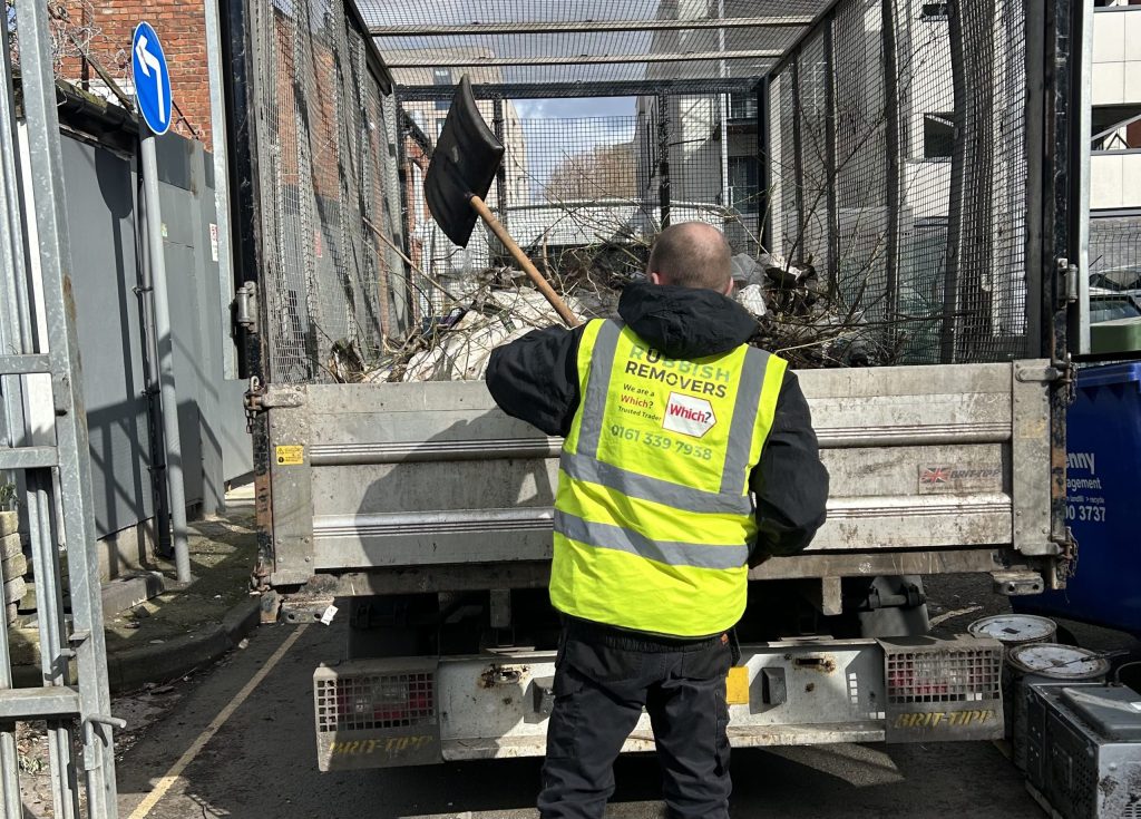 Trusted team member loading green waste onto the van
