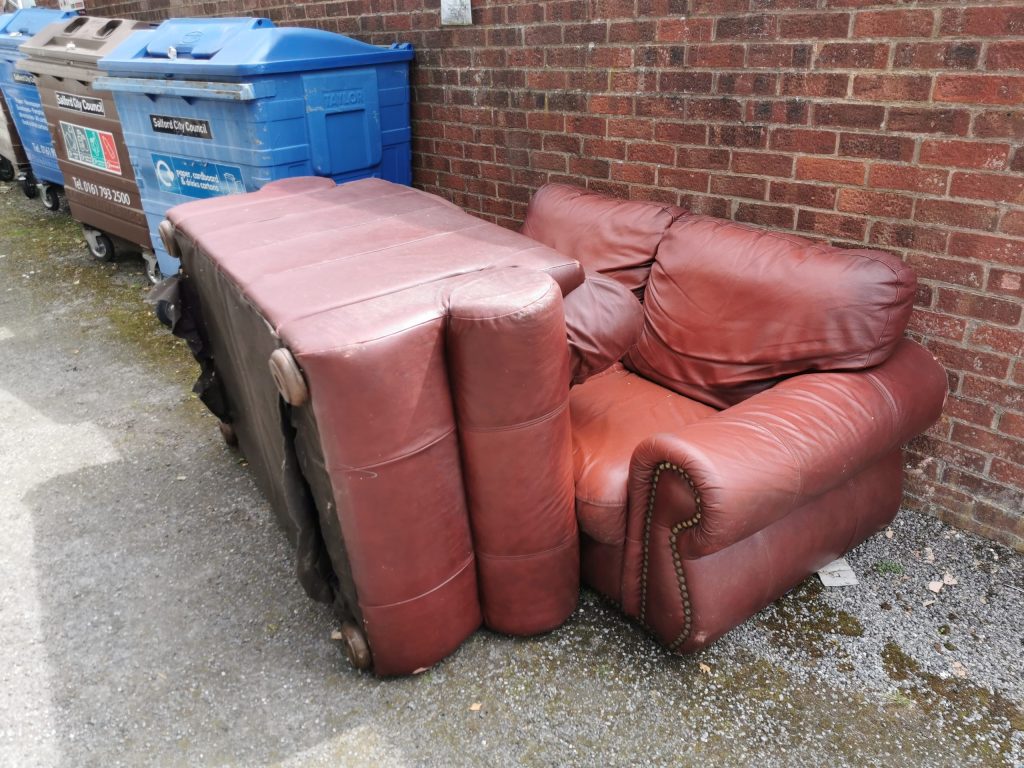 A picture of two fly-tipped sofas that the Rubbish Removers cleared.