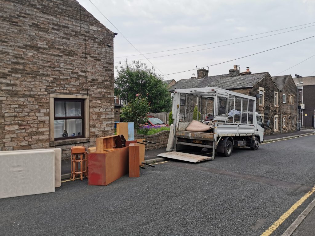 Image showing our vehicle outside of a property ready to load furniture on.