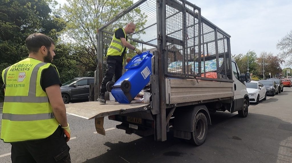 Blue bin waste being loaded onto the van for licensed disposal