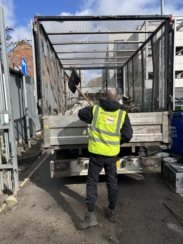 Unwanted green waste being loaded onto the van