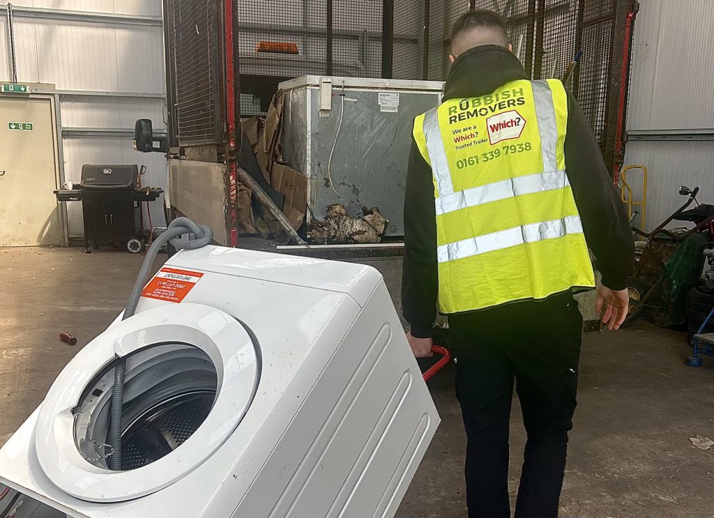 Trusted team loading a washing machine onto the van