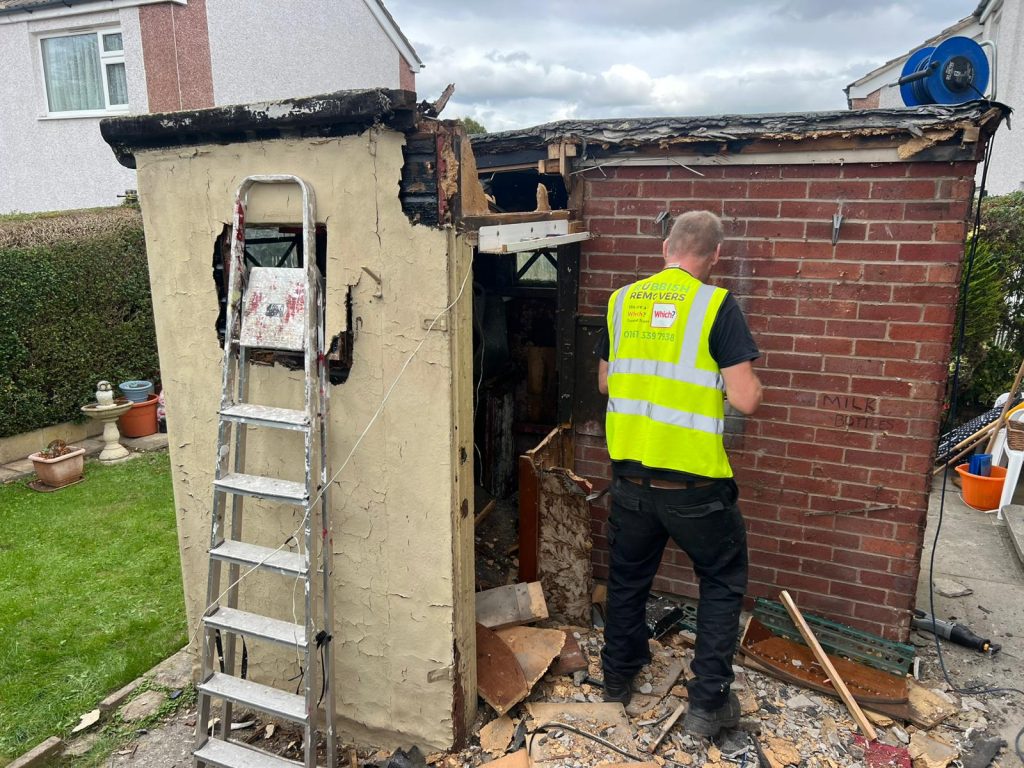 Image of staff dismantling a shed on a property in West Yorkshire.