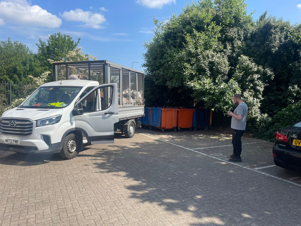 tower block bin clearance team at Castle Court in Salford with four vehicles on site