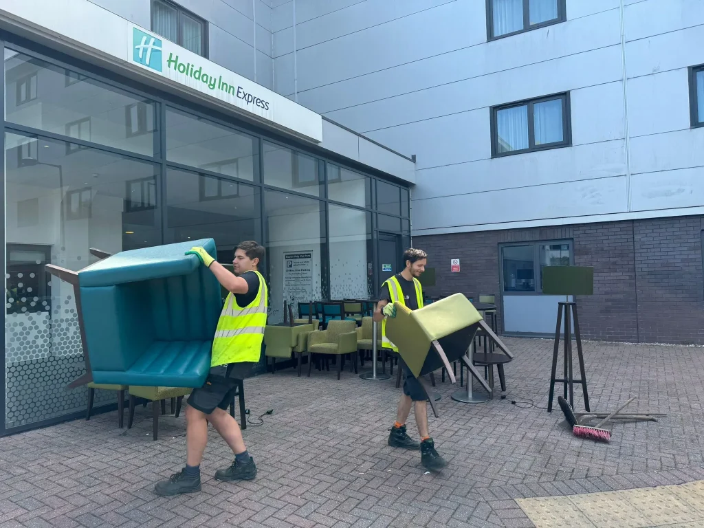 Staff members removing unwanted furniture a from hotel in Wyre