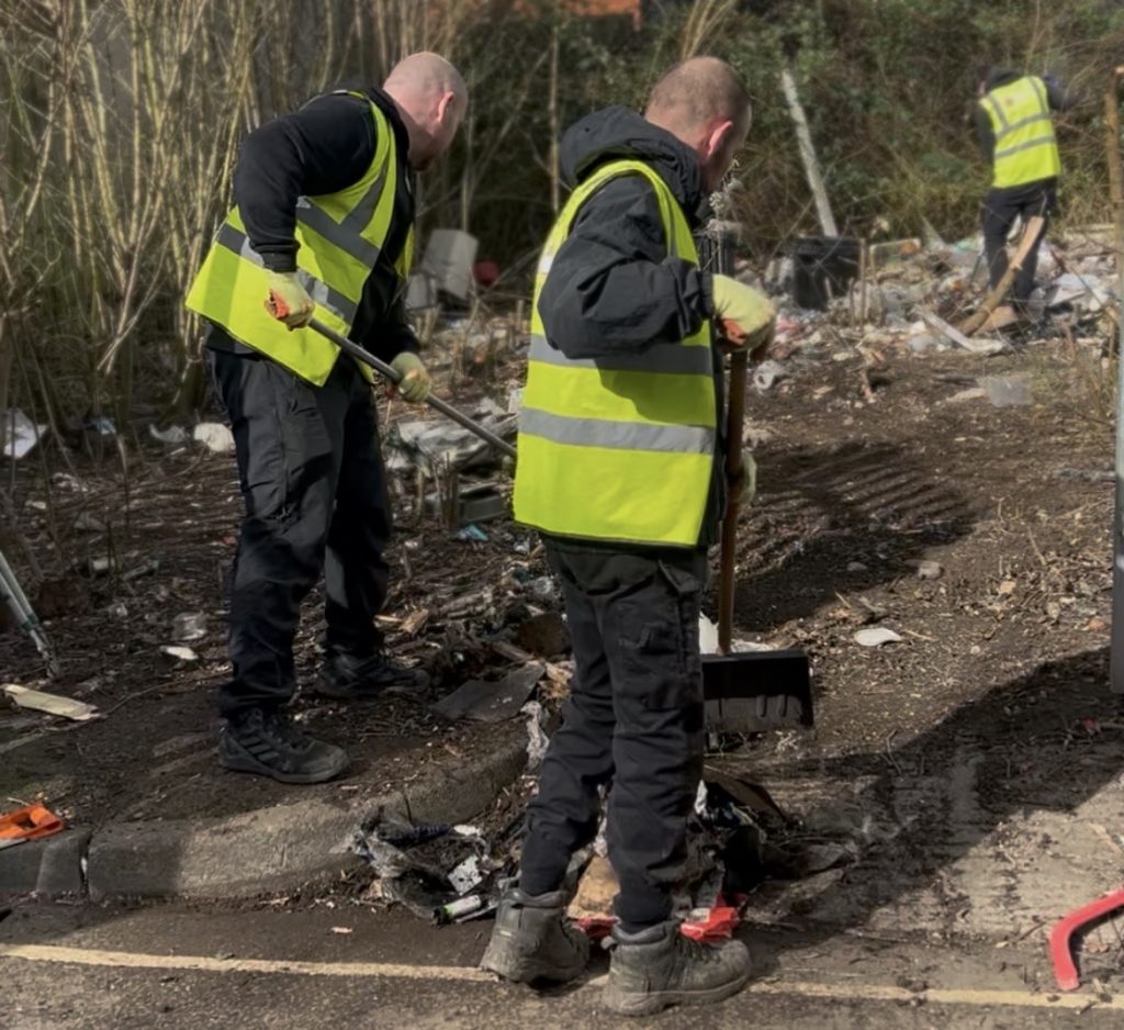 Trusted team members removing fly tipped waste from private land
