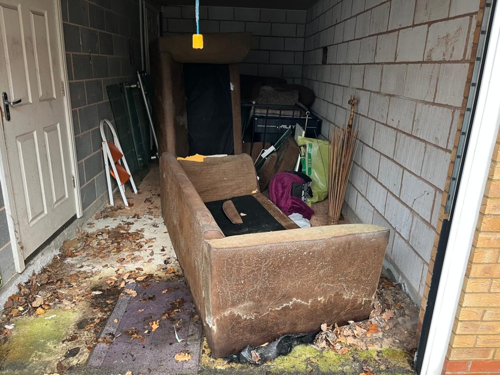 A picture of a shed full of general waste and old furniture that the Rubbish Removers emptied.