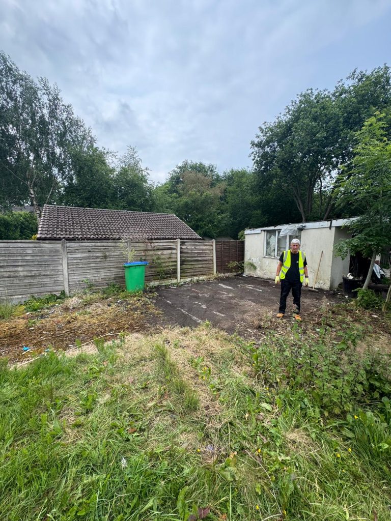 Cleared garden in Heywood ready for landscaping after waste removal.