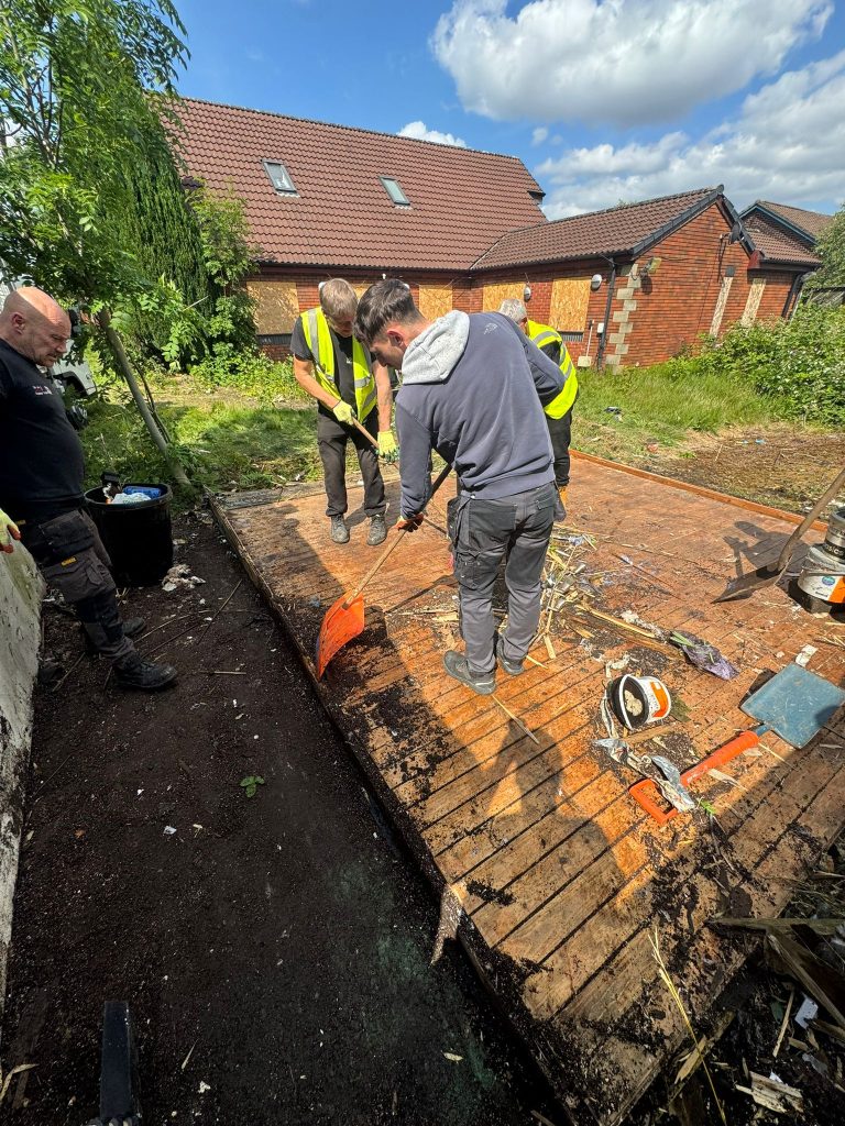 Solicitor-managed garden clearance in Heywood at a repossessed property.